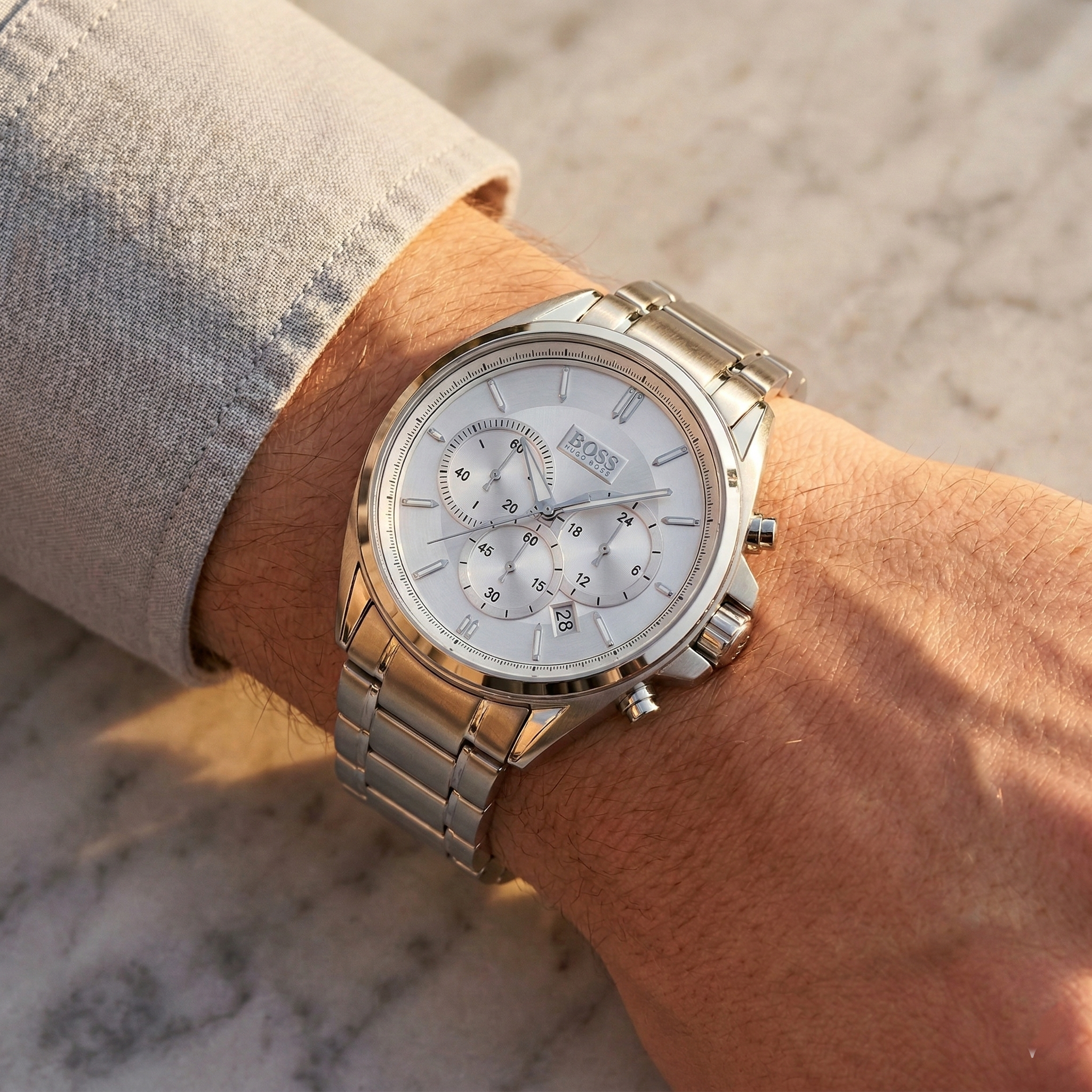 Close up of Hugo Boss Driver 1513039 on wrist showing silver dial and silver metal strap with 30m water resistance