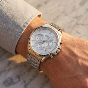 Close up of Hugo Boss Driver 1513039 on wrist showing silver dial and silver metal strap with 30m water resistance