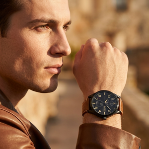 Professional man wearing Hugo Boss Aeroliner Maxx 1513082 with black dial and matte black case tan leather strap water resistant 50m