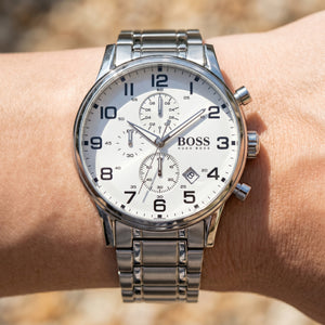Close up shot of Boss Aeroliner 1513182 on wrist showing the sleek silver case and crisp white dial from Luxury Hub Store
