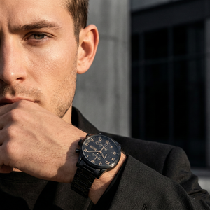 Professional man wearing Hugo Boss Aeroliner 1513275 with black dial and black metal link strap water resistant 50m