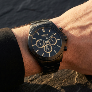 Close up of Hugo Boss Ikon 1513278 on wrist showing black dial and black metal strap with 100m water resistance