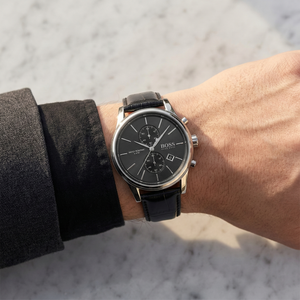Close up of Hugo Boss Jet 1513279 on wrist showing black dial and black leather strap with 50m water resistance