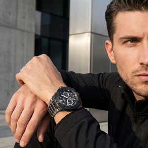 Professional man wearing Hugo Boss Supernova 1513368 with black dial and hybrid metal rubber strap water resistant 50m