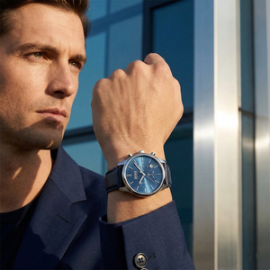 Professional man wearing Hugo Boss Runner 1513431 with blue dial and blue leather strap water resistant 50m
