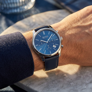 Close up of Hugo Boss Runner 1513431 on wrist showing blue dial and blue leather strap with 50m water resistance