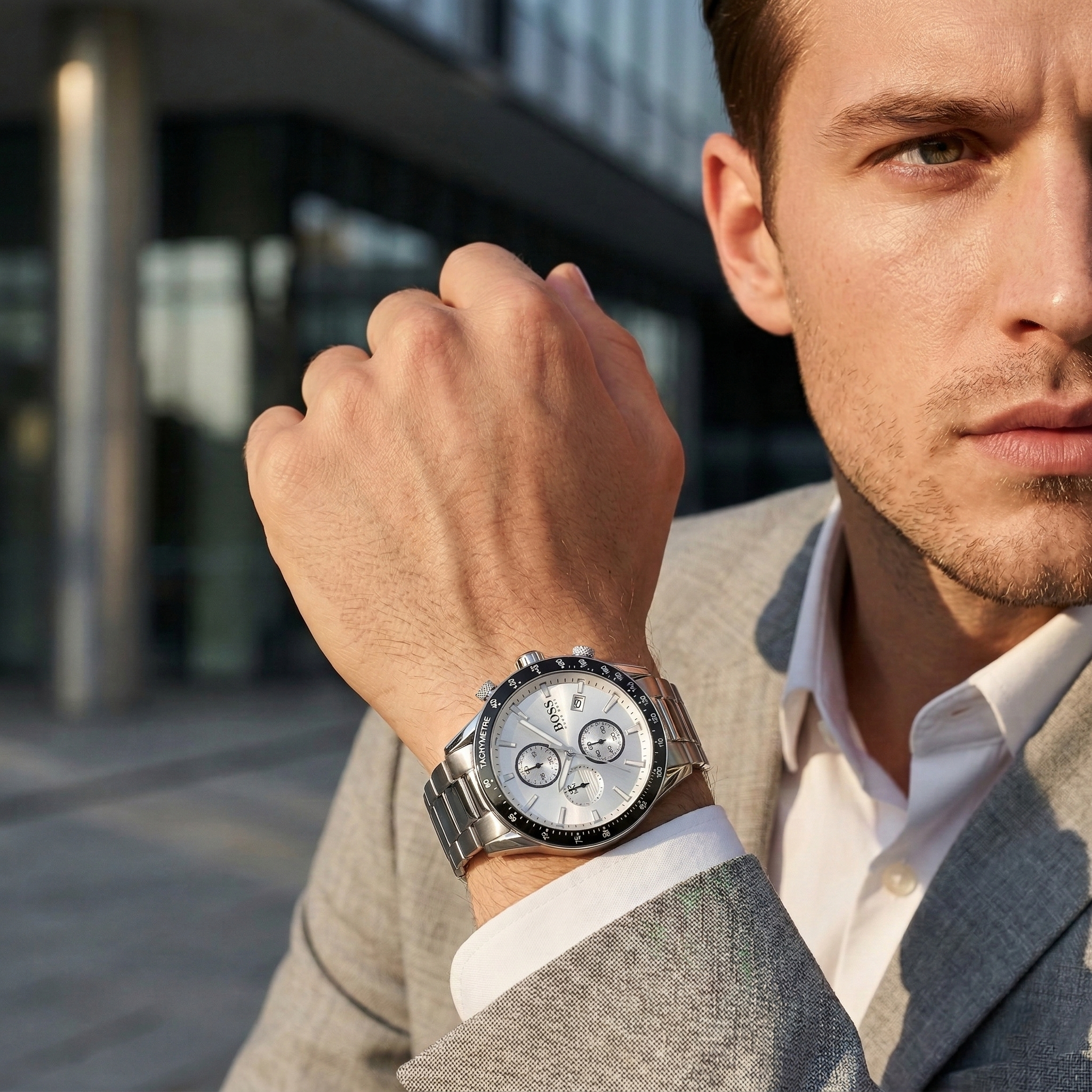 Close up of Hugo Boss Rafale 1513511 on wrist showing silver dial and black bezel with silver metal strap 50m water resistance