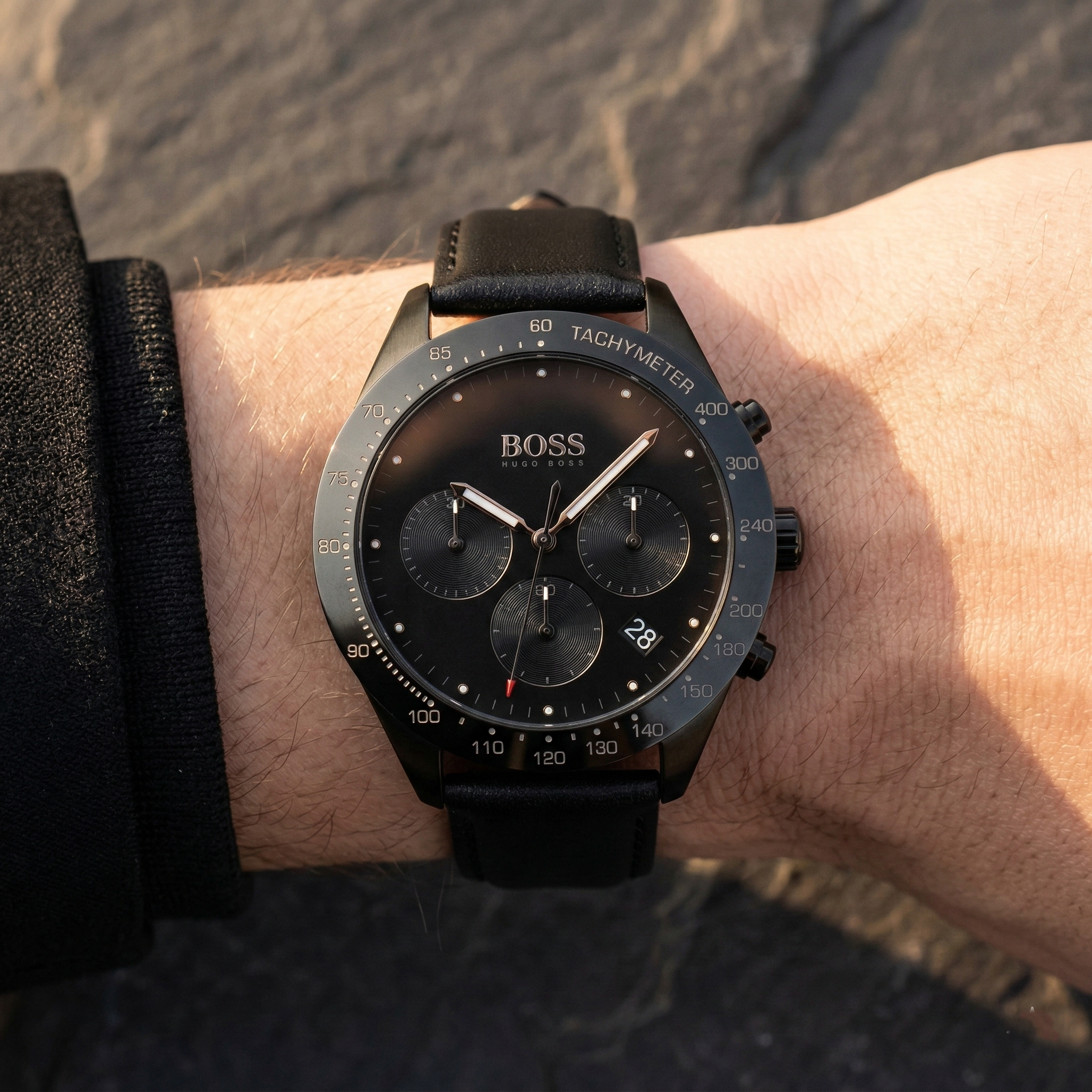 Close up of Hugo Boss Talent 1513590 on wrist showing black dial and black leather strap with 50m water resistance
