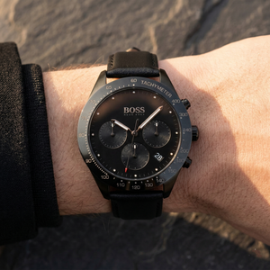 Close up of Hugo Boss Talent 1513590 on wrist showing black dial and black leather strap with 50m water resistance