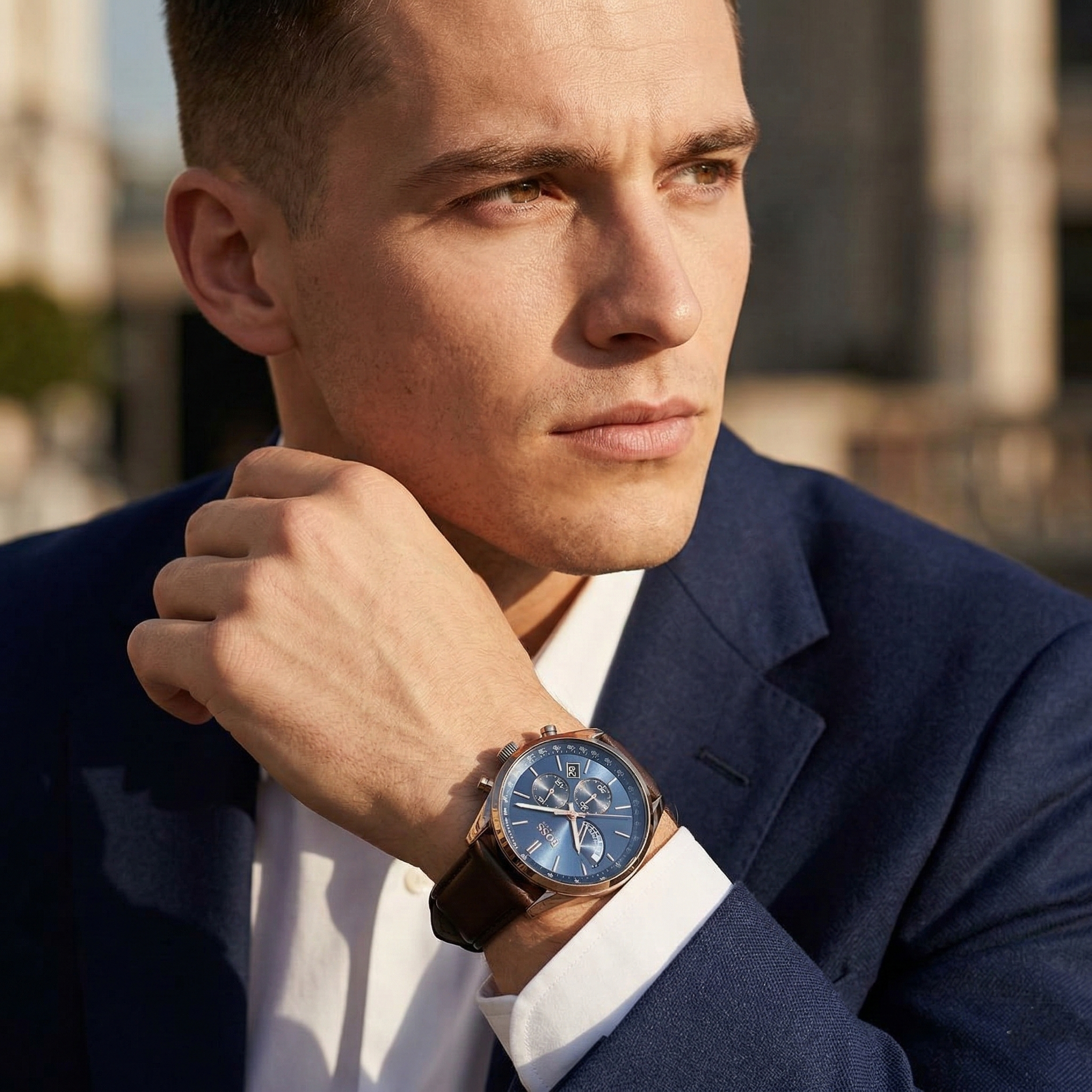 Professional man wearing Hugo Boss Grand Prix 1513604 with blue dial and silver case brown leather strap water resistant 30m