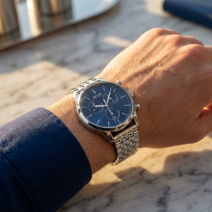 Close up of Hugo Boss Companion 1513653 on wrist showing blue dial and silver metal strap with 50m water resistance