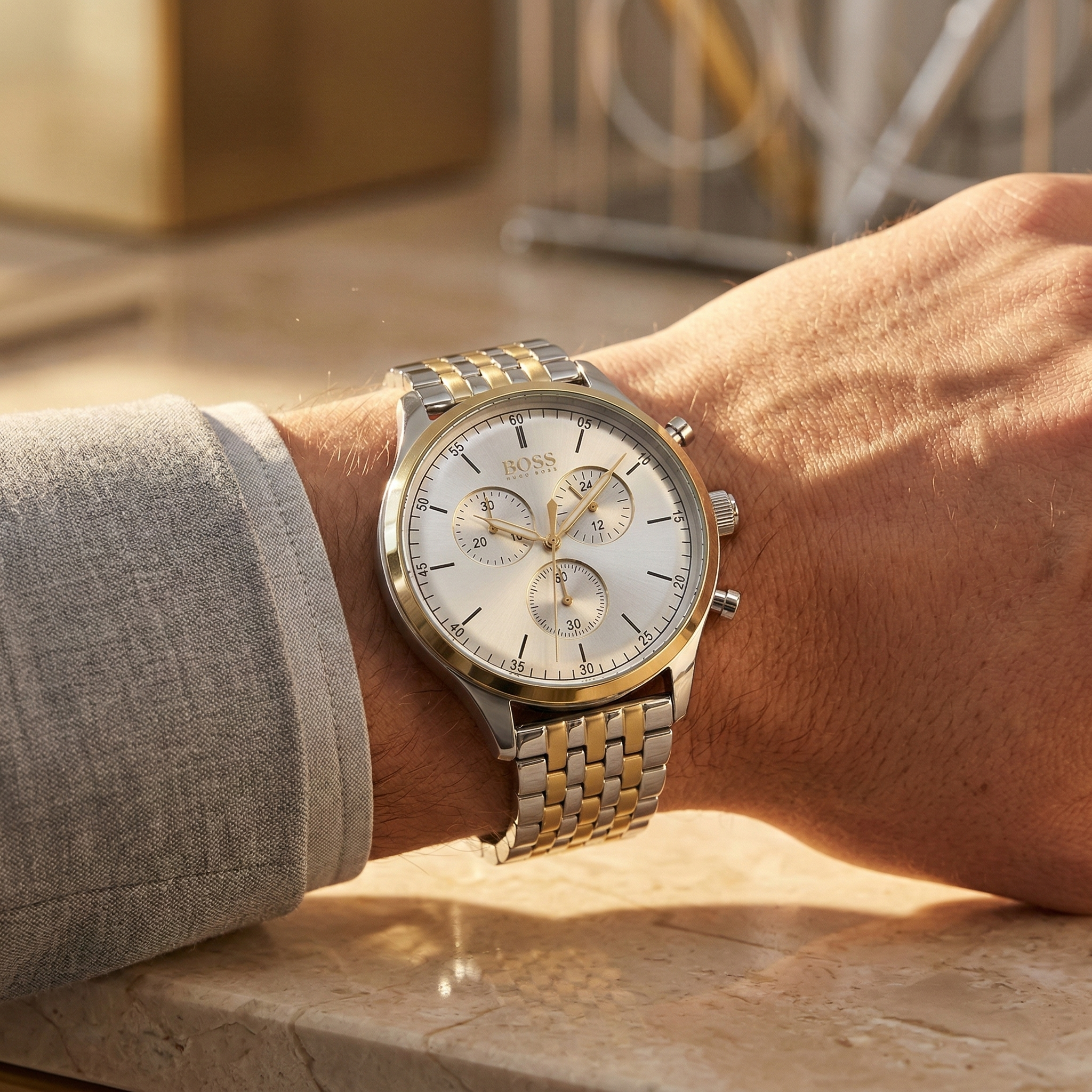 Close up of Hugo Boss Companion 1513654 on wrist showing silver dial and two-tone metal strap with 50m water resistance