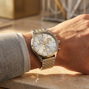 Close up of Hugo Boss Companion 1513654 on wrist showing silver dial and two-tone metal strap with 50m water resistance