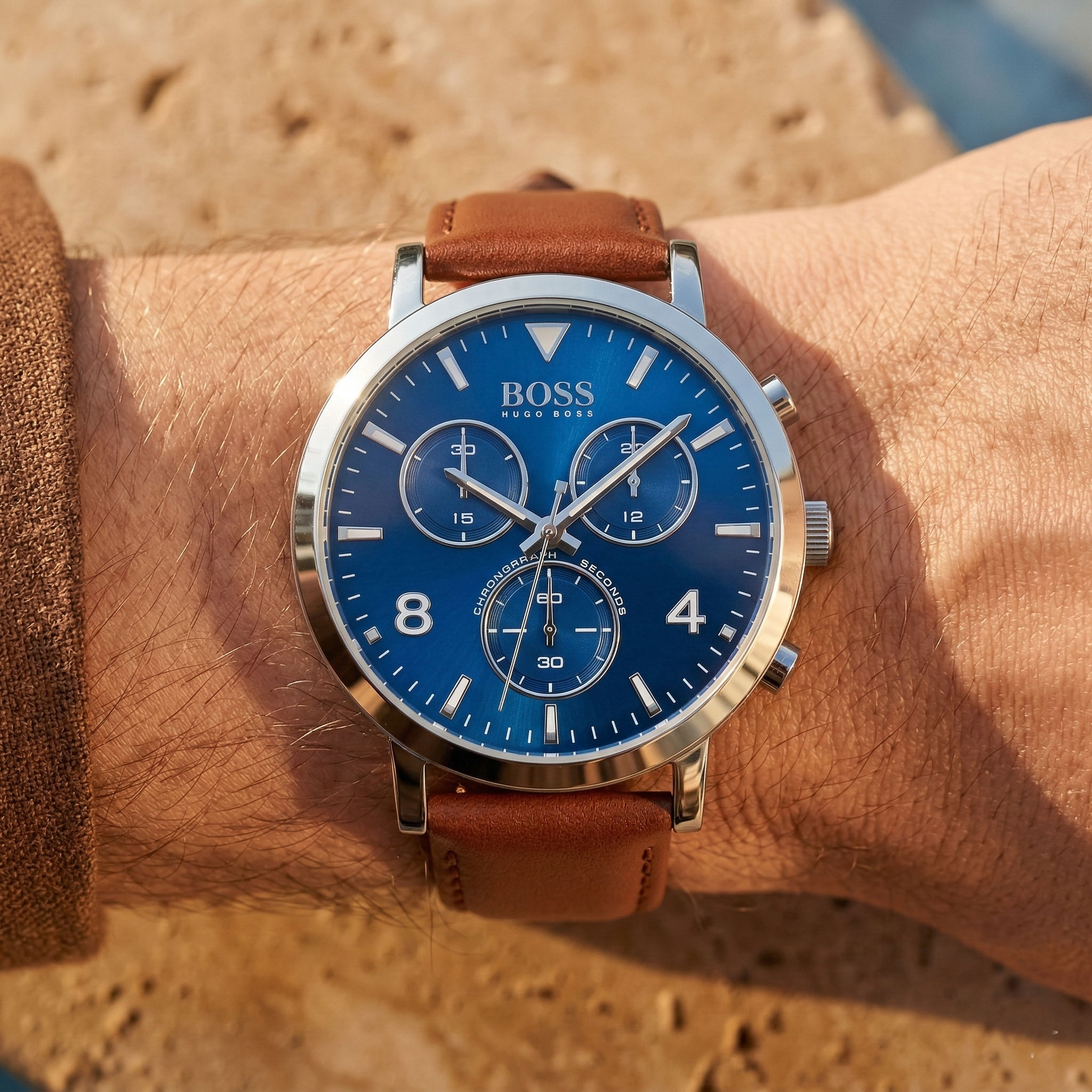 Close up of Hugo Boss Spirit 1513689 on wrist showing blue sunray dial and brown leather strap with 30m water resistance