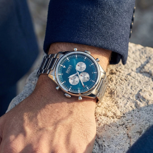 Close up of Hugo Boss Pioneer 1513713 on wrist showing blue dial and silver metal link strap with 50m water resistance