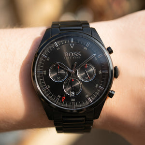 Raw close-up shot of Boss Pioneer 1513714 on wrist showing the black dial color and chronographic details from Luxury Hub Store.
