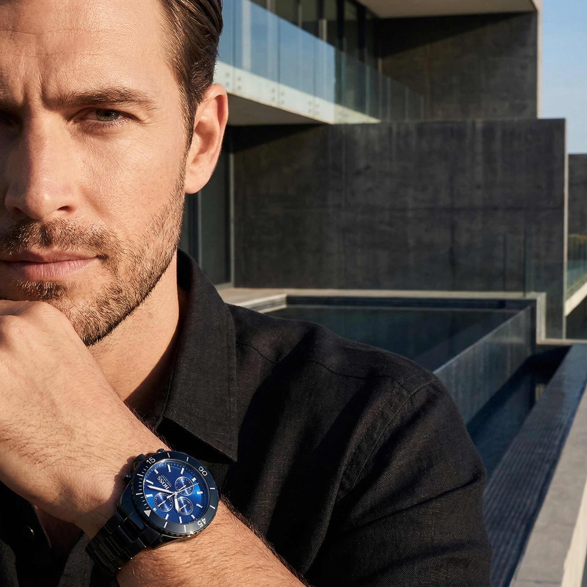 Professional explorer wearing Hugo Boss Ocean Edition 1513743 with blue dial and black metal strap water resistant 100m