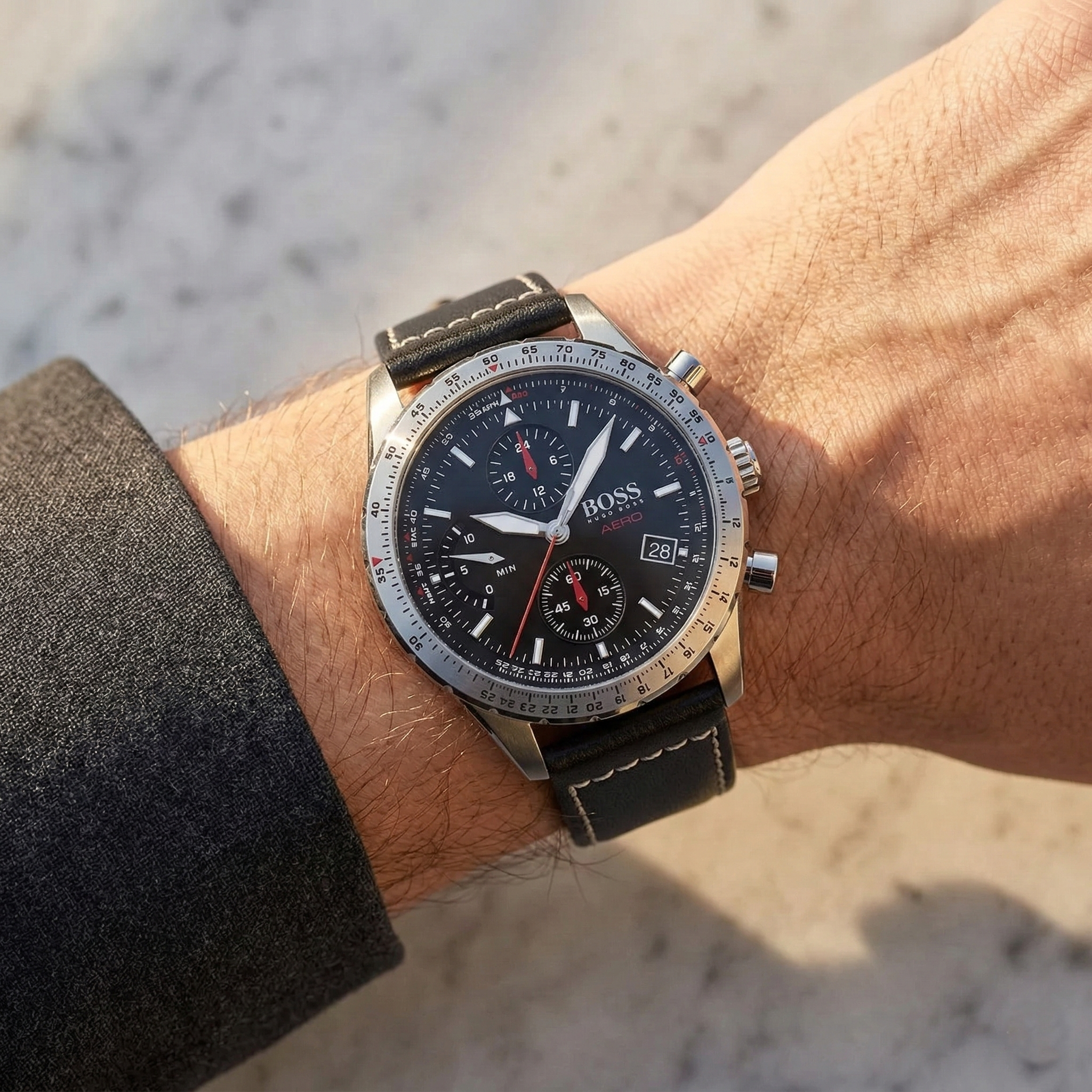 Close up of Hugo Boss Aero 1513770 on wrist showing black dial and black leather strap with 50m water resistance