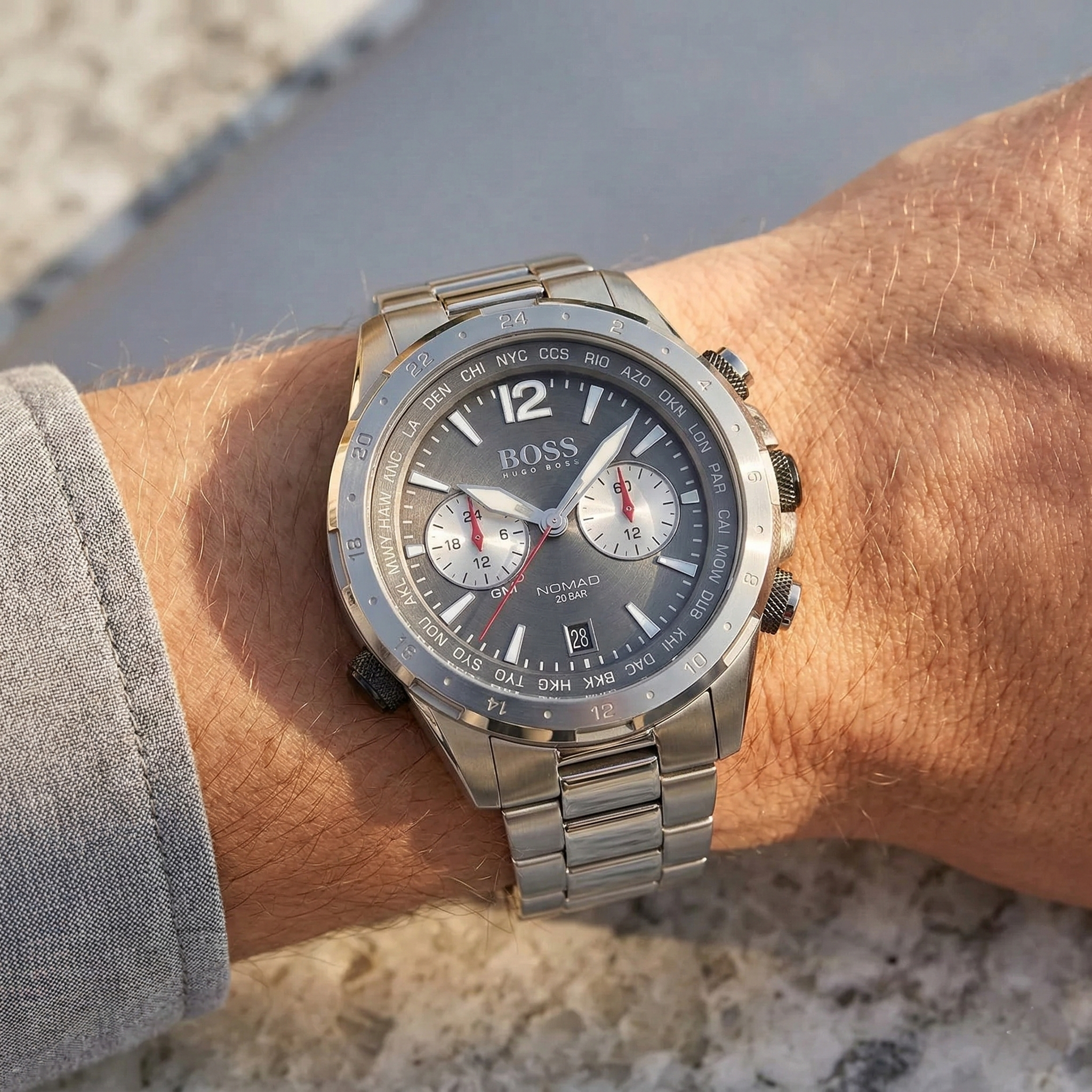 Close up of Hugo Boss Nomad 1513774 on wrist showing gray dial and silver metal link strap with 50m water resistance
