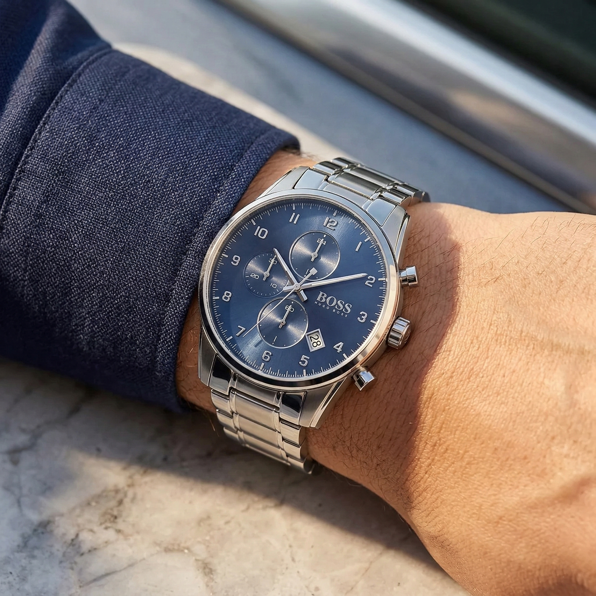 Close up of Hugo Boss Skymaster 1513784 on wrist showing blue dial and silver metal strap with 50m water resistance