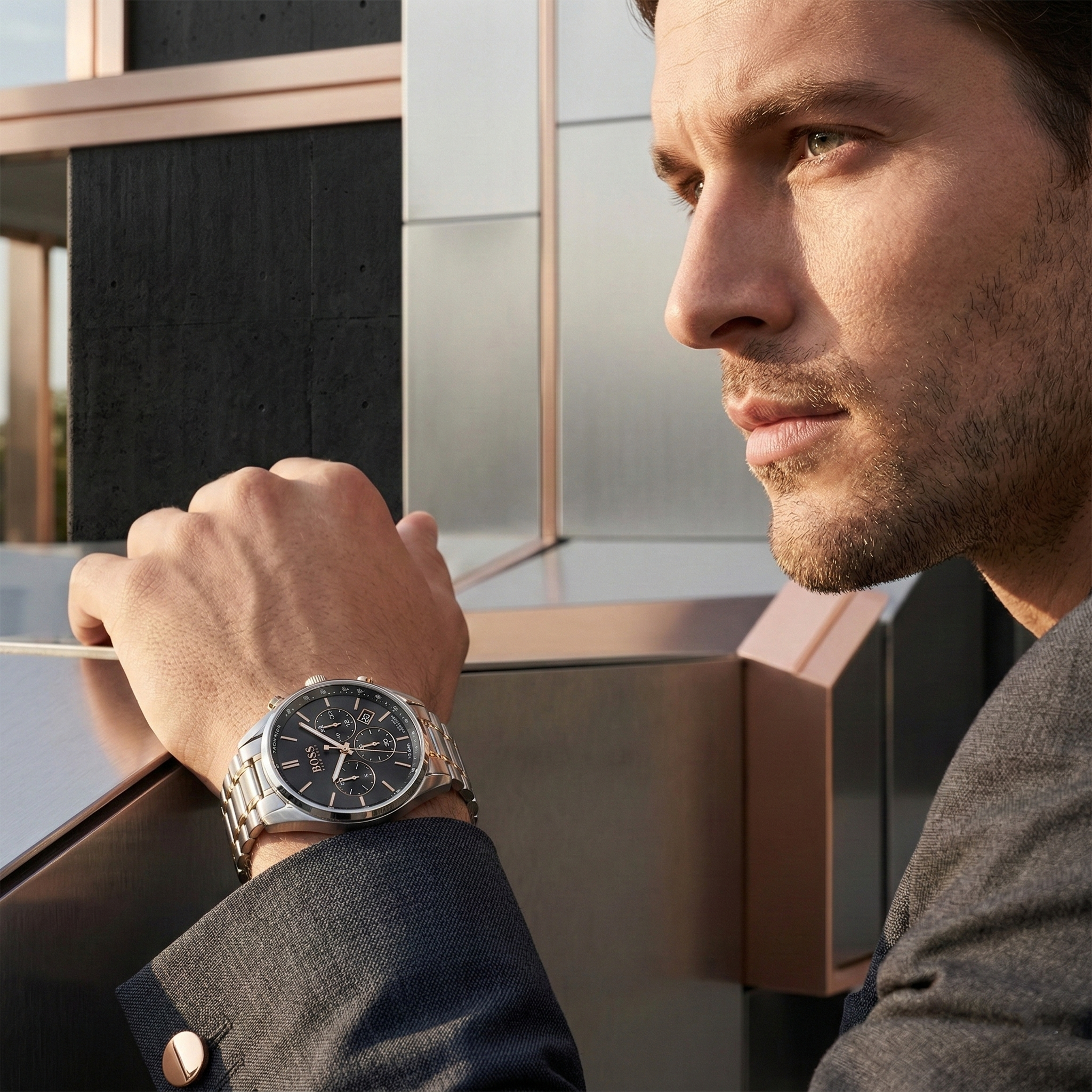Professional man wearing Hugo Boss Champion 1513819 with black dial and silver rose gold metal strap water resistant 100m