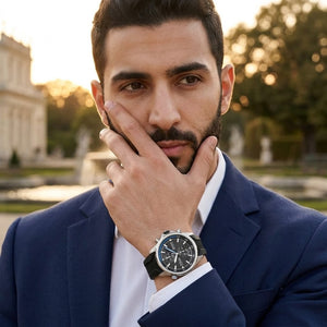 Lifestyle luxury shot featuring Hugo Boss Globetrotter 1513820 men's watch.
