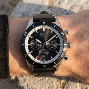 Close up of Hugo Boss Santiago 1513864 on wrist showing black dial and black leather strap with 50m water resistance
