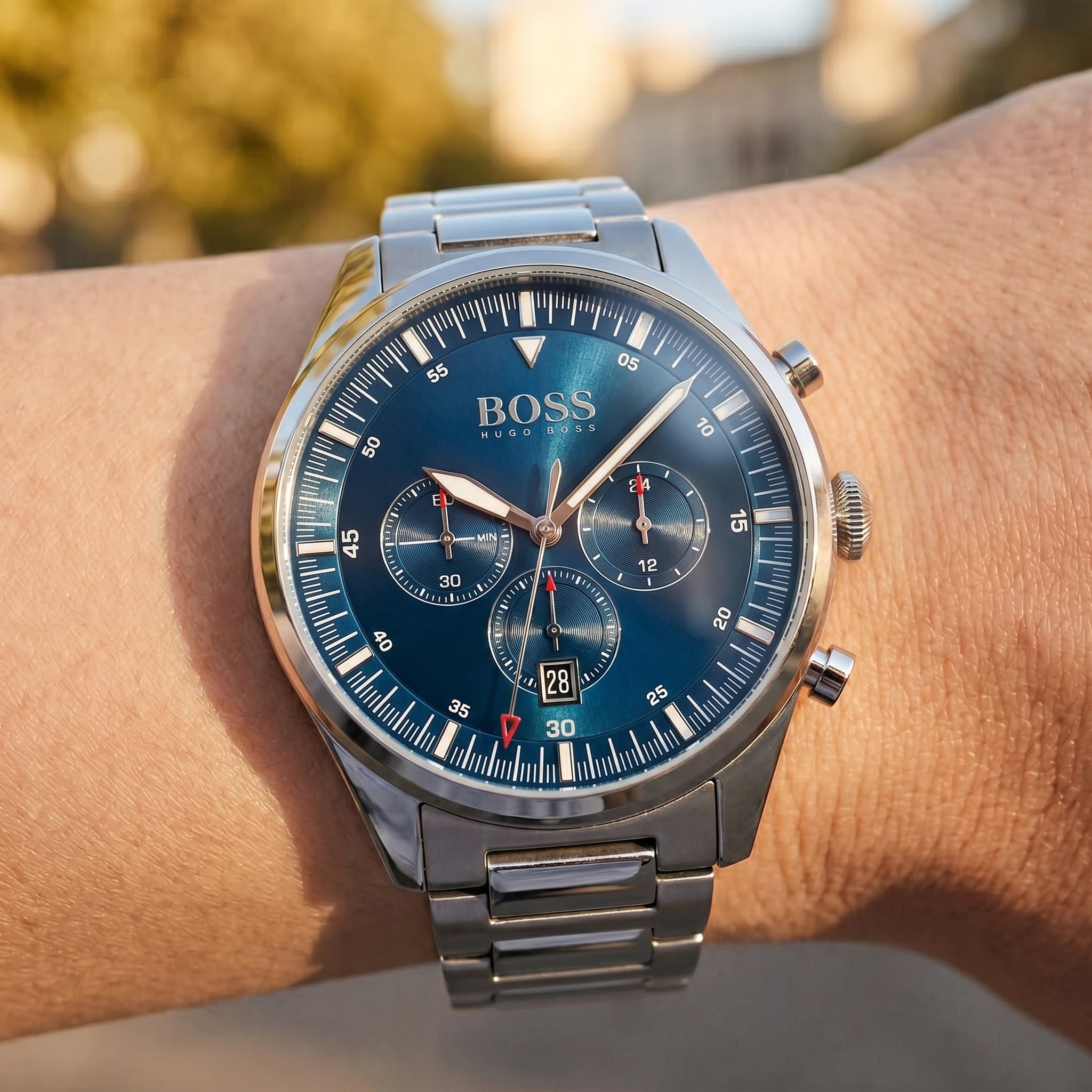 Close up shot of Boss Pioneer 1513867 on wrist showing the large silver case and multifunction dial from Luxury Hub Store
