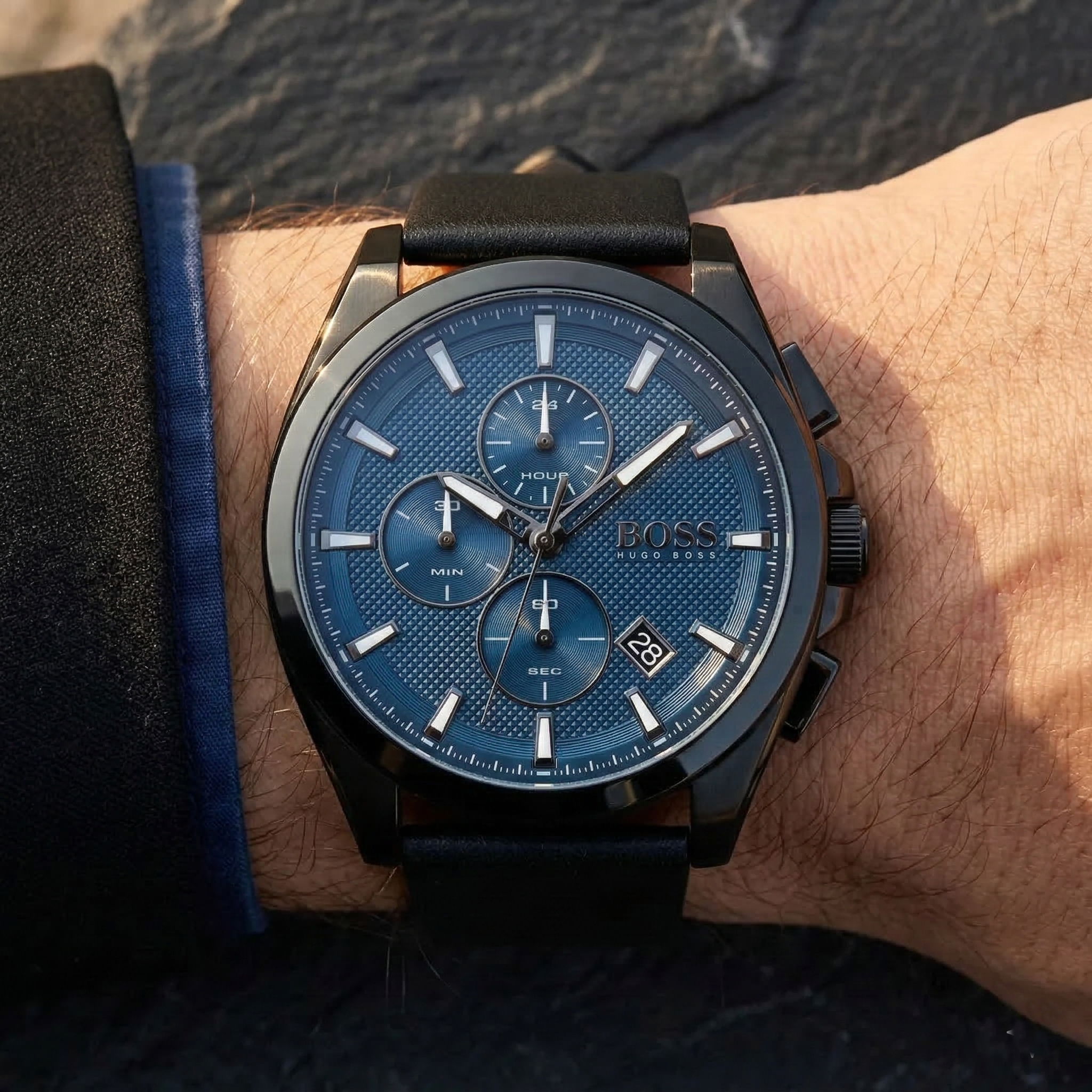 Close up of Hugo Boss Grandmaster 1513883 on wrist showing blue textured dial and black leather strap with 50m water resistance