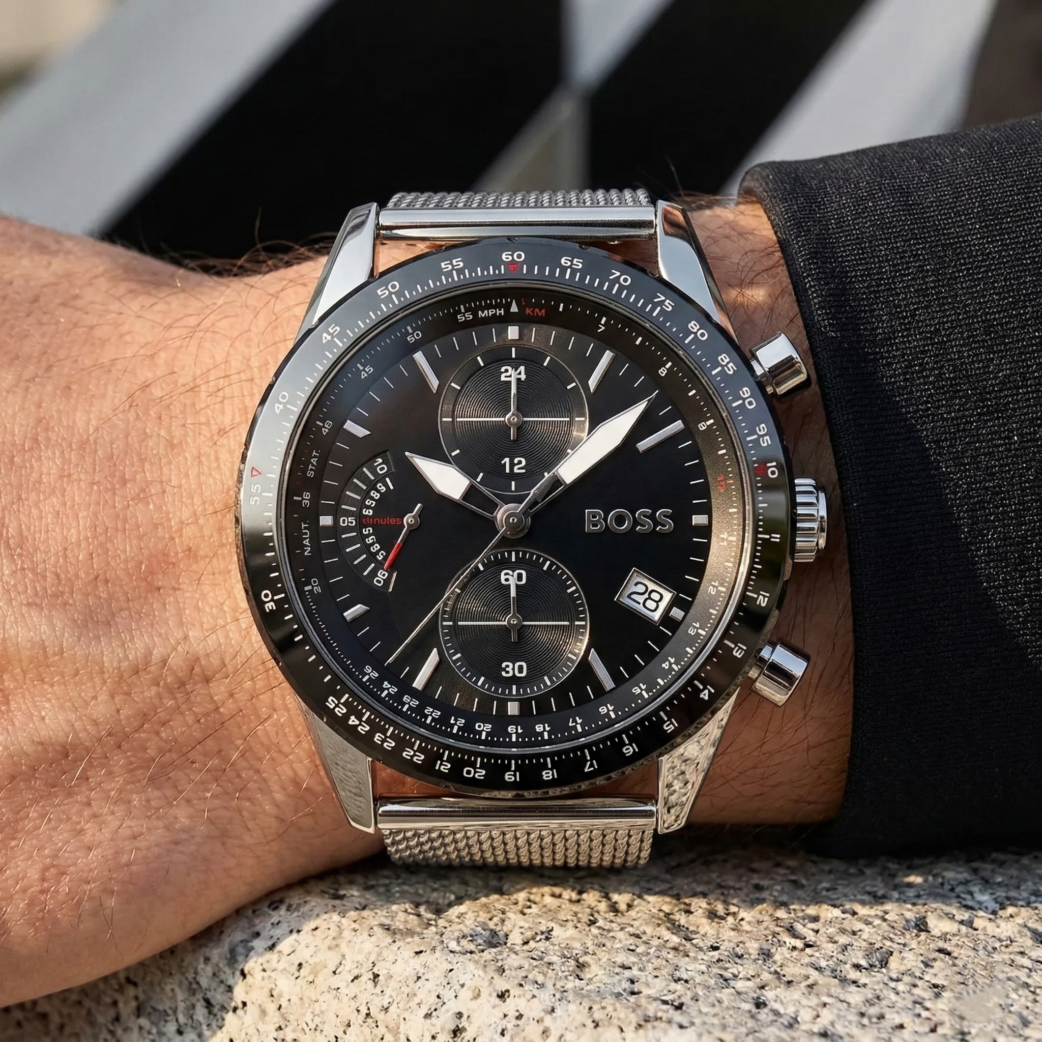 Close up of Hugo Boss Pilot Edition 1513886 on wrist showing black dial and silver metal mesh strap with 50m water resistance