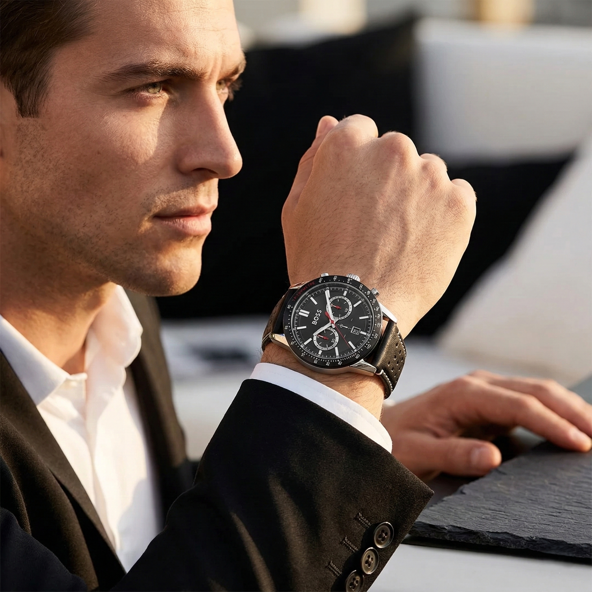 Close up of Hugo Boss Allure 1513920 on wrist showing black dial and black leather strap with 50m water resistance