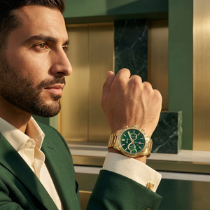 Professional man wearing Hugo Boss Allure 1513923 with green dial and gold metal strap water resistant 50m