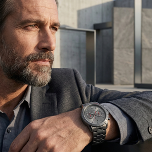 Professional man wearing Hugo Boss Allure 1513924 with gray dial and gray metal strap water resistant 50m