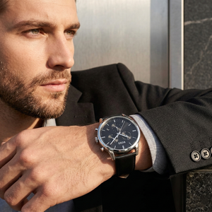 Professional man wearing Hugo Boss Dapper 1513925 with black dial and silver case leather strap water resistant 50m