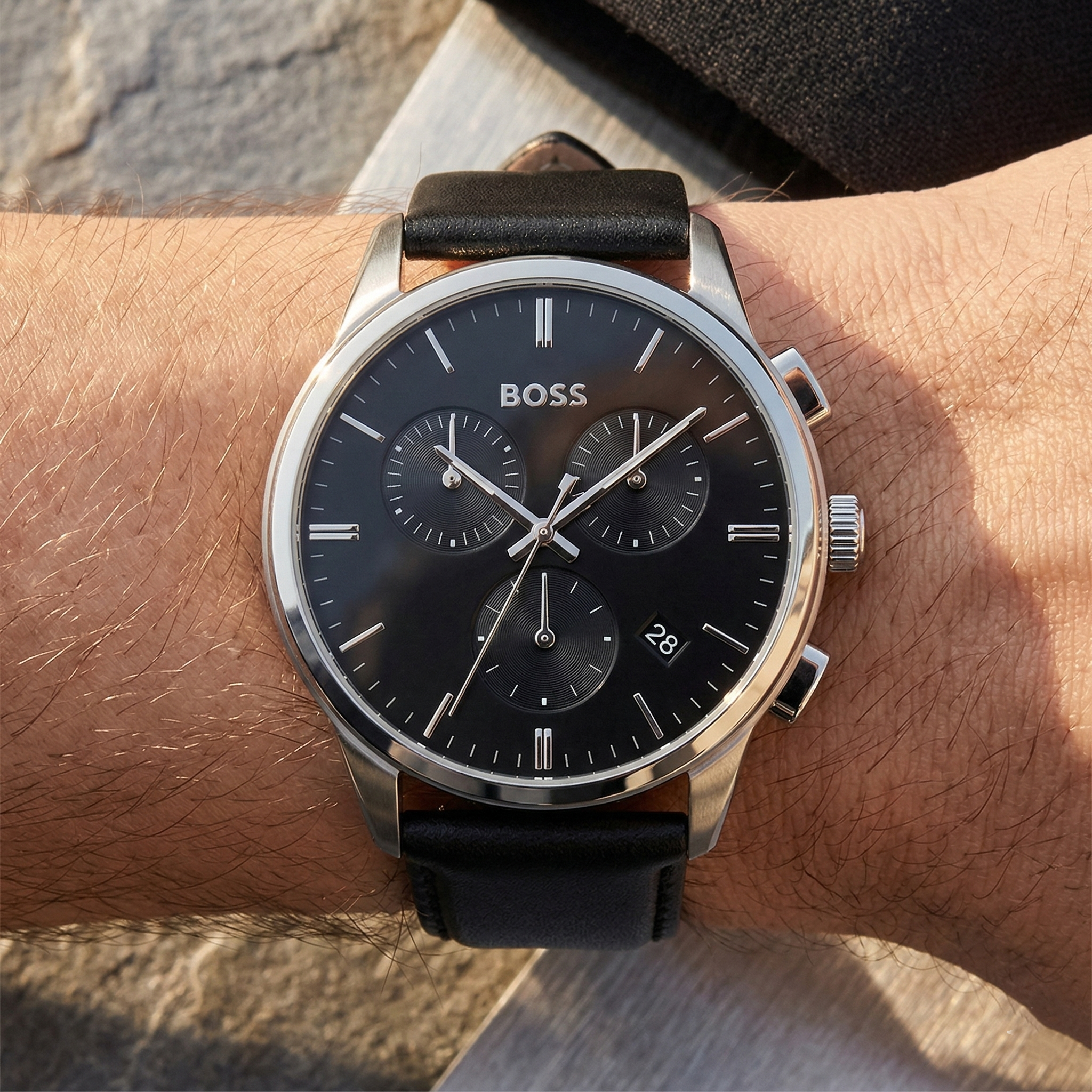 Close up of Hugo Boss Dapper 1513925 on wrist showing black sunray dial and leather strap with 50m water resistance