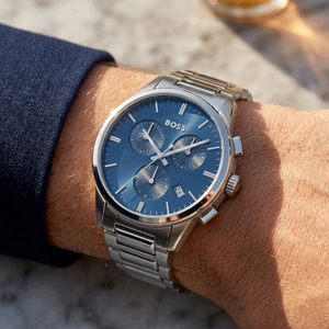 Close up of Hugo Boss Dapper 1513927 on wrist showing blue dial and silver metal link strap with 50m water resistance