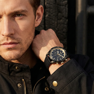 Professional man wearing Hugo Boss Santiago 1513935 with black dial and black case fiber strap water resistant 50m