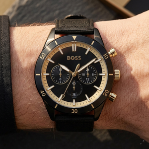 Close up of Hugo Boss Santiago 1513935 on wrist showing black dial and black synthetic fiber strap with 50m water resistance