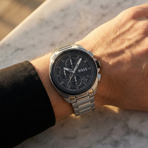 Close up of Hugo Boss Volane 1513949 on wrist showing black dial and silver metal strap with 50m water resistance