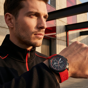 Professional man wearing Hugo Boss Volane 1513959 with black dial and red rubber strap water resistant 50m