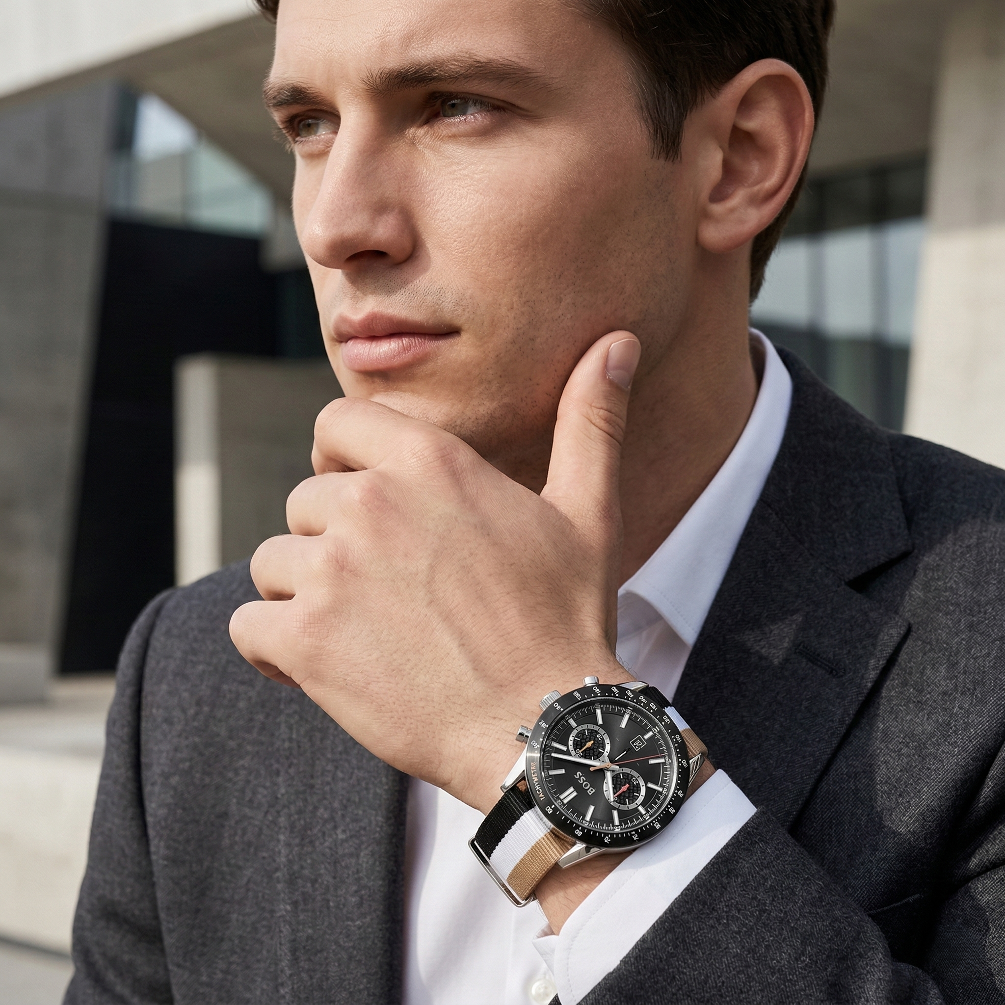 Professional man wearing Hugo Boss Allure 1513963 with black dial and multicolored fiber strap water resistant 50m