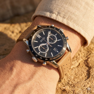 Close up of Hugo Boss Allure 1513964 on wrist showing black dial and perforated beige leather strap with 50m water resistance