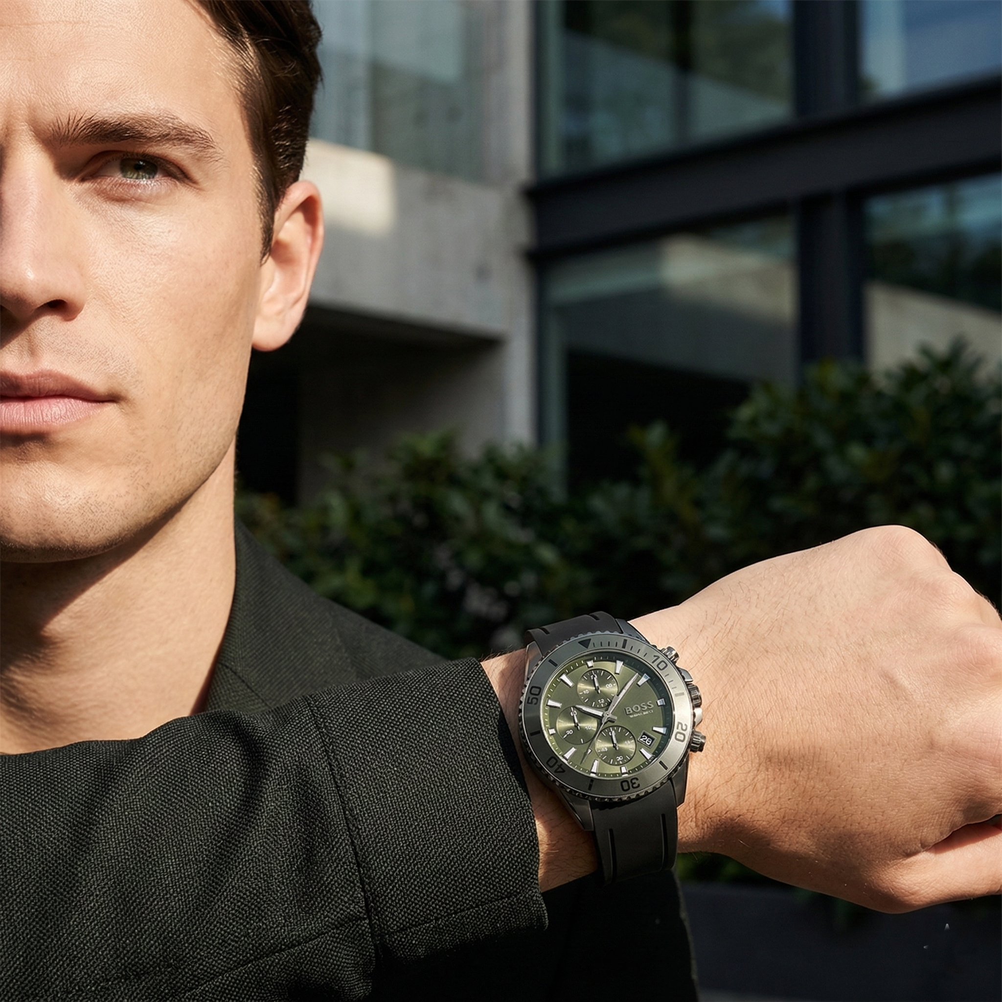 Professional leader wearing Hugo Boss Admiral 1513967 with green dial and black rubber strap water resistant 100m