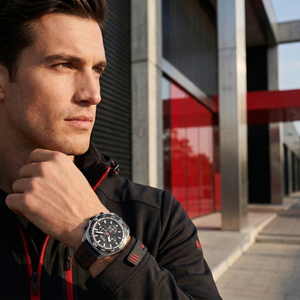 Sporty man wearing Hugo Boss Runner 1513969 with black dial and black rubber strap water resistant 50m