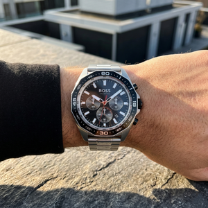 Close up of Hugo Boss Energy 1513971 on wrist showing black sunray dial and silver metal link strap with 50m water resistance