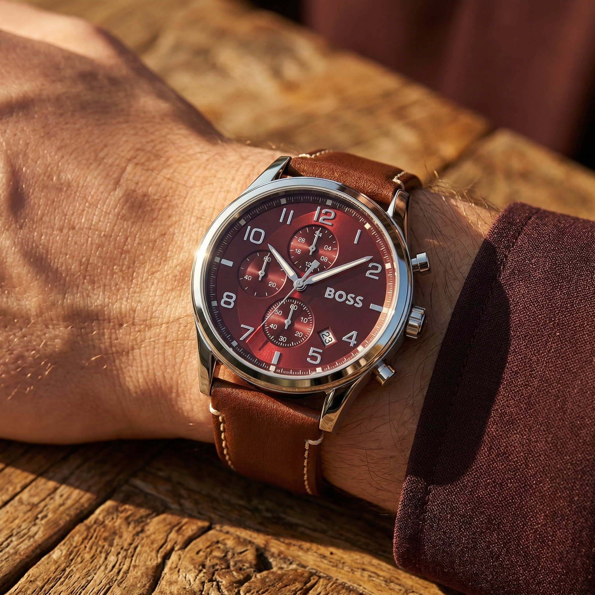 Close up of Hugo Boss View 1513988 on wrist showing red dial and brown leather strap with 50m water resistance