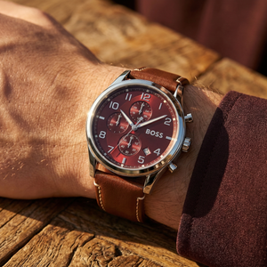Close up of Hugo Boss View 1513988 on wrist showing red dial and brown leather strap with 50m water resistance