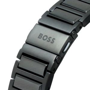 Close-up of a black watch strap with 'BOSS' branding on a white background