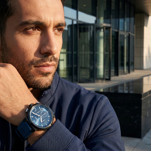 Professional man wearing Hugo Boss Runner 1513998 with blue dial and blue rubber strap water resistant 50m