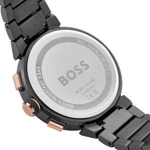 Close-up of a BOSS watch with a metallic band on a white background